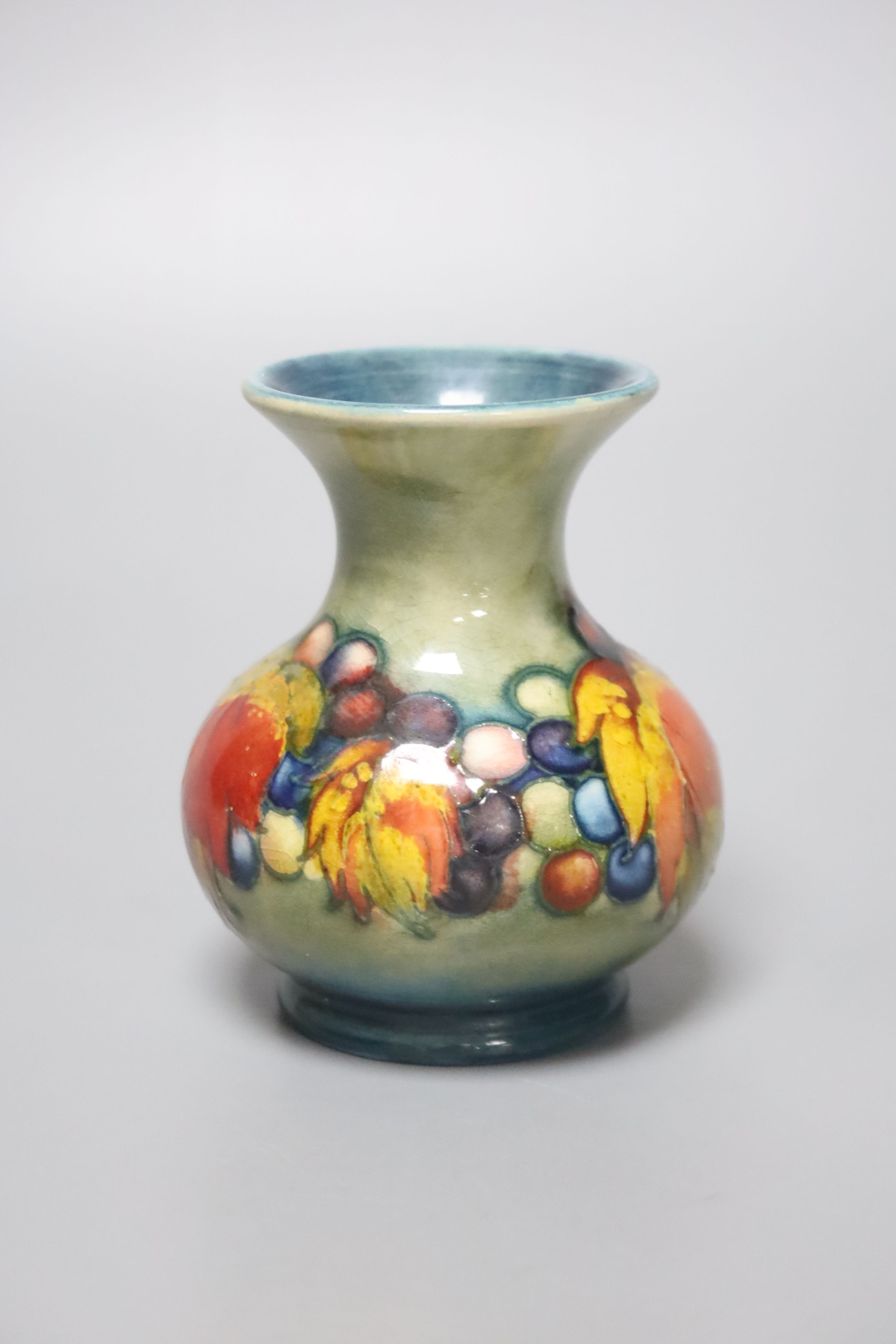 A small Moorcroft flambe leaf and berry vase, height 9cm